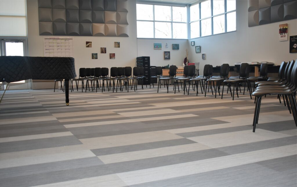 Capozza Commercial Division - 24371 - Ledgewood Construction - Lewiston High School - Music Room - Flotex - Carpet Tile - Modular Planks - Cement - Almond - Charcoa - Copy