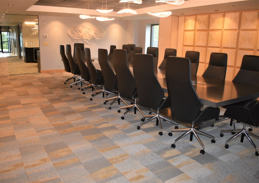 Capozza Commercial Division, 24697, Landry/French, Corporate Offices, Conference Room, Mannington Carpet, Collection Living Series Achievements, Intrepid, T7284, Atlas, Mixed Metals Colorway, Carpet Squares, Modular Carpet, open concept to lounge area, break room, Milliken, Heavy Meta, Foundry, FD220-15, Bronze